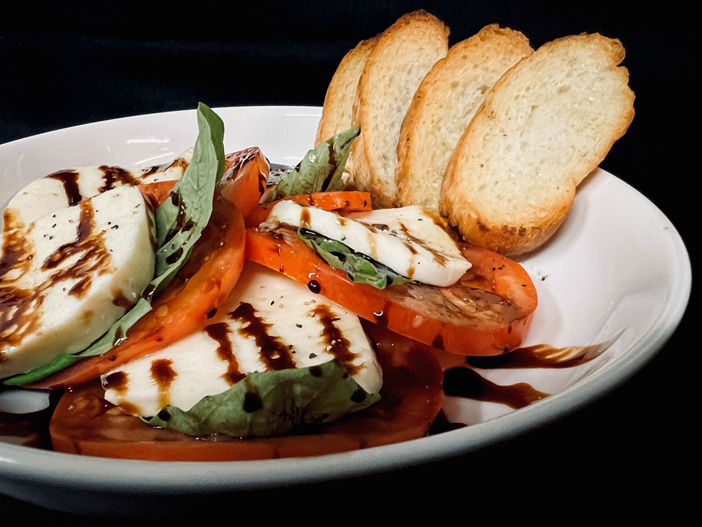 mozzarella buratta with fresh tomato and balsalmic reduction